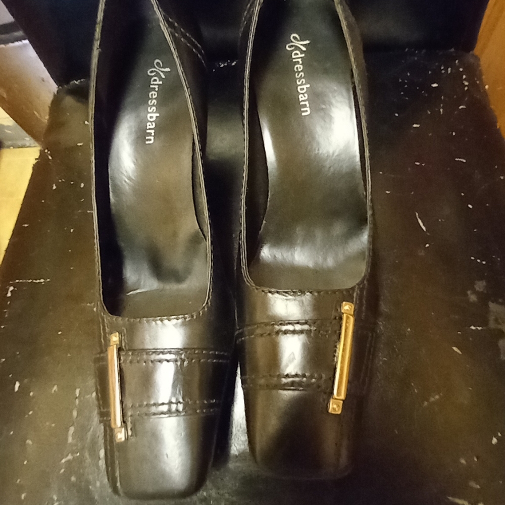 Black heels with a silver buckle